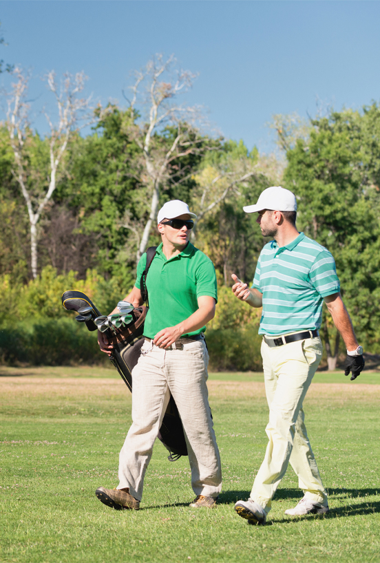 Golfers walking together with a golf bag on an Augusta GA golf course